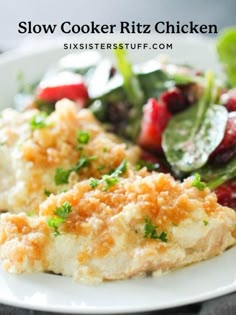 chicken breast with crumbs and vegetables on a white plate