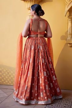 Orange jamewar skirt in floral pattern. Paired with a glass bead and zardosi embroidered scoop neck blouse and tulle dupatta. - Aza Fashions Fitted Floor-length Dresses With Motifs, Fitted Dress With Motifs For Festive Season, Saree Dress With Motifs For Reception, Tilla Dress For Navratri Reception, Navratri Reception Dress With Tilla Detailing, Bohemian Orange Choli For Wedding, Fitted Dresses With Motifs For Diwali, Fitted Dresses With Motifs For Festive Occasions, Fitted Art Silk Dresses With Motifs