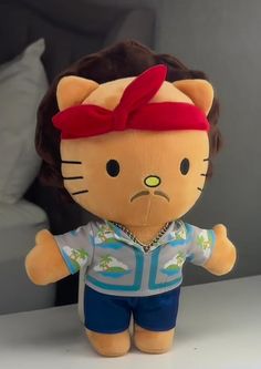 a hello kitty doll with a red bow on her head