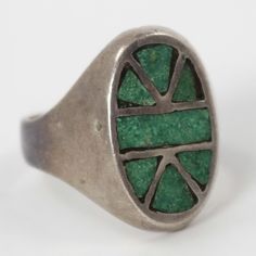 1950s Zuni Sterling Silver Ring with Channel Inlaid Natural American Turquoise. Ring Size: 6.75.125” - .75” Band Width Unique Green Inlay Rings, Vintage Hallmarked Turquoise Ring, Vintage Oval Turquoise Ring Hallmarked, Vintage Green Enamel Ring For Anniversary, Vintage Green Turquoise Ring With Inlay, Vintage Multi-stone Green Emerald Ring, Vintage Green Emerald Ring With Multi-stone, Vintage Green Multi-stone Turquoise Ring, Vintage Hallmarked Turquoise Ring For Collectors