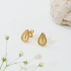 Embrace the allure of our pear-shaped gold earrings, adorned with meticulous granulations and crowned by a sparkling brilliant gem at the heart, an exquisite expression of timeless elegance and sophistication. 100% handmade in our workshop. Metal: 14K Gold| 18K Gold Gemstones: Diamond | weight 0,033 ct  Discover the art of personalization as you select your dream jewelry, choosing the perfect gemstone that resonates with your unique style. Our dedicated team is always ready to assist, ensuring a Gold Teardrop Diamond Earrings For Anniversary, Gold Pear-shaped Diamond Earrings, Classic Gold Teardrop Diamond Earrings, Classic Gold Teardrop Earrings With Diamond Accents, Gold Teardrop Earrings Fine Jewelry, Gold Teardrop Diamond Earrings, Gold Teardrop Diamond Earrings For Gift, Gold Pear Shaped Teardrop Earrings, Byzantine Style Yellow Gold Earrings With Intricate Design