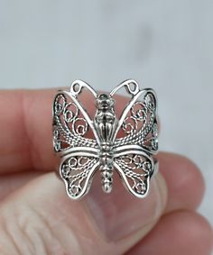 "Filigree art butterfly design women cocktail ring. Simple in design and graceful in presentation, this ring is an elegant addition to your collection. With its delicate filigree design, this Sterling Silver Filigree Art Butterfly Design Women Cocktail Ring will be a lovely and meaningful accessory you can wear on any occasion.  Gorgeous, delicate, and elegant silver filigree engagement ring with a butterfly. This ring will make your look special and unique. The 925 sterling silver jewelry is handmade by talented artisans and is perfect for any occasion. Beautifully crafted butterfly figure is enhanced by the filigree design. This will make an excellent gift for your loved one. With its oxidized, highly polished surface and classic look, this silver ring is the perfect accessory to an eleg Filigree Rings For Women, Butterfly Cocktail, Metal Embroidery, Locket Ring, Filigree Engagement Ring, Art Butterfly, Oyster Bay, Filigree Jewelry, Silver Polish