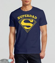 a man wearing a blue superman t - shirt