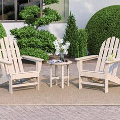 two chairs and a table on a patio