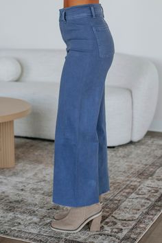 Details: Linsley Wide Leg Pants High Rise Zip Fly Button Closure Wide Leg Denim Material Minimal Stretch Raw Edge Frayed Hems Available in Multiple Colors Rise: 12" Inseam: 28" Material: 98% Cotton and 2% Spandex We are recommending: Small - Sizes (24-25) Medium - Sizes (26-27) Large - Sizes (28-29) Fall Washed Blue Bottoms With Button Closure, Indigo Washed Bottoms For Spring, Washed Blue Cotton Pants, Non-stretch Light Wash Pants, Indigo Wide Leg Bottoms With Relaxed Fit, Washed Blue Full-length Pants For Fall, Washed Blue Full Length Pants For Fall, Blue Washed Bottoms For Spring, Blue Cropped Leg Jeans