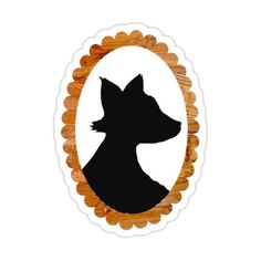 the silhouette of a dog in a round frame