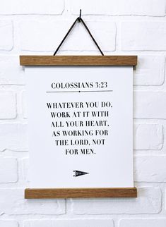 a sign hanging on a brick wall that says colossians 22 whatever you do work at with all your art as working for the lord not for men