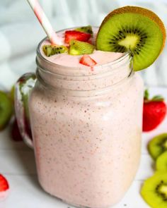 a smoothie with kiwis and strawberries in it