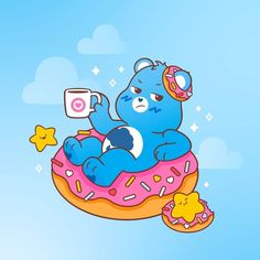 a blue teddy bear sitting on top of a donut