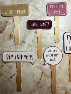 six popsicles with wine sayings on them