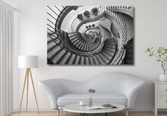 a spiral staircase in black and white is featured on the wall