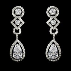 CZ Bridal and Formal EarringsAdd a glamorous touch to your wedding day or special occasion with these sparkling cz earrings. These beautiful cubic zirconia bridal earrings will add lots of sparkle to your bridal look. Available in both pierced and clip on styles, these earrings will be perfect for your special day.Color: Silver plated setting/clear stones.Size: 1.75" long and .5" wide.Style: 3824.Please allow 1 week for delivery.Shipping Policy.Return Policy Cubic Zirconia Bridal Earrings, Wedding Earrings Chandelier, Formal Earrings, Bridal Earrings Chandelier, Simple Silver Jewelry, Dazzling Earrings, Clear Earrings, Crystal Chandelier Earrings, Bridal Fashion Jewelry