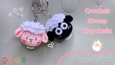 two crocheted sheep keychains hanging from a chain