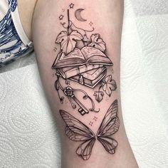 a tattoo design with books and butterflies on the arm, which is surrounded by other things