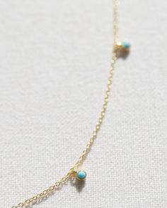 Made with 14k gold vermeil, this dainty necklace features beautiful turquoise satellite beads. Chain length is adjustable. measures 17.5" at longest, 15.5" at shortest Dainty Blue Necklaces With Satellite Chain, Dainty Blue Necklace With Satellite Chain, Adjustable Turquoise Jewelry With Delicate Chain, Gold Adjustable Minimalist Turquoise Necklace, Dainty Blue Turquoise Necklace With Adjustable Chain, Minimalist Adjustable Gold Turquoise Necklace, Dainty Blue Turquoise Necklace With Tiny Beads, Adjustable Minimalist Gold Necklace, Dainty Adjustable Turquoise Necklace With Tiny Beads