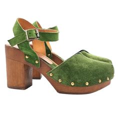 Dutch style clogs, practical and comfortable, perfect for any occasion. Clogs with Brown Wood effect base - Upper in green suede - Adjustable strap - Heel height 9.5 cm and 3 cm plateau - Entirely made by specialized Italian personnel - Handcrafted using the best materials - Very comfortable and elegant. - BEFORE COMPLETING YOUR PURCHASE DO NOT FORGET TO CHECK THE SIZE! Green Round Toe Platform Mules, Casual Green Open-heel Mules, Summer Green Mules With Wooden Heel, Casual Suede Clogs With Heel Loop, Green Open Heel Mules, Casual Green Heels With Reinforced Heel, Green Suede Sandals With Round Toe, Green Suede Closed Toe Sandals, Green Clogs With Wooden Heel For Spring