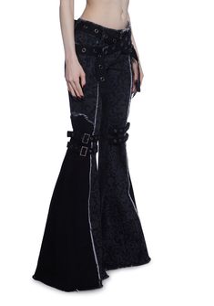 These pants have a stretchy twill construction with a printed filigree design, raw edge detailing, a raw hem and waistband, flare legs, a dual belt design on the legs with buckle closures, grommet detailing, front and back pockets, an adjustable crisscross waist belt closure, and a front button and zipper closure. Faux Fur Shrug, Fur Shrug, Belt Design, Filigree Design, Dolls Kill, Gothic Fashion, Raw Edge, Waist Belt, Flare Pants