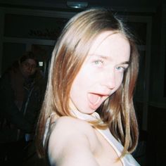 a woman making a funny face with her tongue out