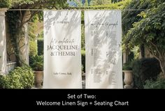 two welcome linen signs in front of trees