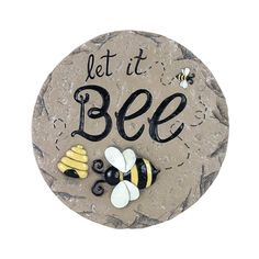 a stone sign that says let it bee