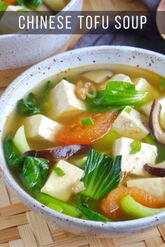 a white bowl filled with tofu and vegetables