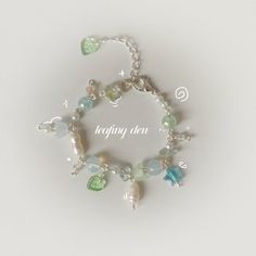 "springtime collection 2/5 *.o - s h o p o p e n i n g - o  o  🌿🌧️ \"leafing dew\" inspired by the rain-laden baby leaves of spring silver plated, lobster clasp, with pearl, fluorite chips, acrylic and glass beads ｡*ﾟ*. o .*o*\"˜ - store carefully in a cool dry place eg. a jewellery box - please keep out of water and other substances to prevent tarnish - handle carefully to prevent breakage - clean with a soft cloth .*o*\"˜ love,  meihuagui \"bringing you the dusty beauty of pressed flowers... Bead Bra, Cat Charm Bracelet, Ethereal Jewelry, Handmade Aesthetic, Manik Manik, Gelang Manik, O Love, Business Idea, Fancy Jewellery