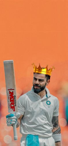 a man with a crown on his head holding a cricket bat