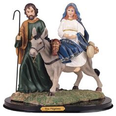 the figurine depicts jesus and mary on a donkey