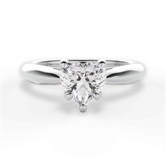 a white gold engagement ring with a pear shaped diamond