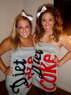 two young women dressed in costumes posing for the camera