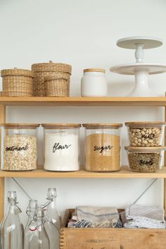 the shelves are filled with different types of jars and containers, including one for storage