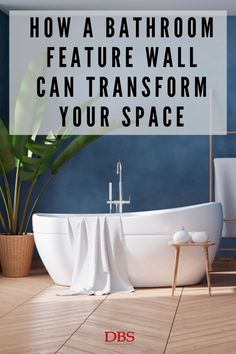 a bathroom with blue walls and white bathtub next to a potted plant on the floor