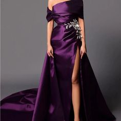 Formal Gown. Never Worn. Bride Changed Her Mind. Dress Is Pretty. The Actual Appliqu Is A Little Different On The Dress Purple One-shoulder Dress For Banquet, Purple Gown With Sweep Train For Banquet, Purple Evening Dress With Sweep Train For Banquet, Purple Satin Evening Dress With Sweep Train, Purple Satin Dress With Sweep Train, Purple Floor-length Dress For Banquet, Purple One-shoulder Gown For Wedding, Purple One-shoulder Dress For Wedding, Elegant Purple Maxi Dress For Banquet