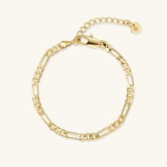 Our Figaro chain bracelet is a gold staple to wear alone or stack with our other gold filled bracelets. Our 14k gold-filled jewelry is bonded with 14k gold and is water and tarnish resistant. 14k gold-filled jewelry is a great alternative to solid gold, and can be worn by people with sensitive skin. The color will not tarnish but recommend to keep away from perfumes and lotions. - 14k gold-filled- Chain width: 3.5 mm. - Chain length options: 6" or 6" + 2" extender- Shower safe / Tarnish resistan Figaro Bracelet, Bracelet Christmas, Gold Armband, Bracelet Dainty, Dainty Bracelet, Christmas Bracelet, Bracelet Chain, Figaro Chain, Christmas Gift For Her