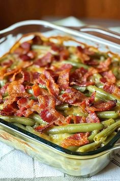 a casserole dish filled with green beans and bacon