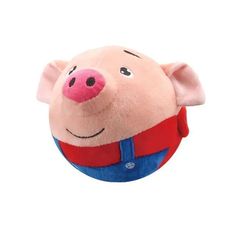 a small stuffed pig with a red shirt and blue pants on it's head