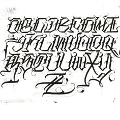 some type of lettering that is very fancy and elegant, it looks like an old school tattoo