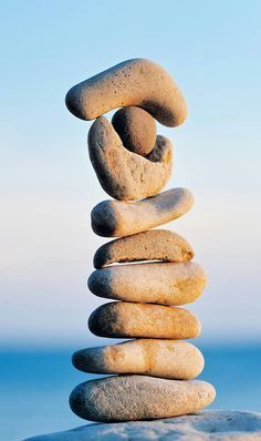 a stack of rocks sitting on top of a beach