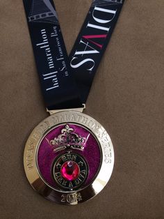 a medal with a purple ribbon around it