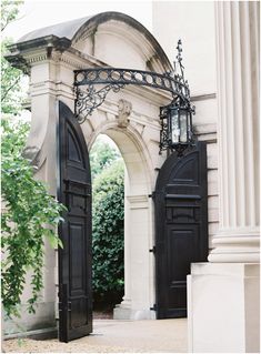 an open door leading to a white building