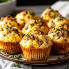 several muffins on a plate with parsley