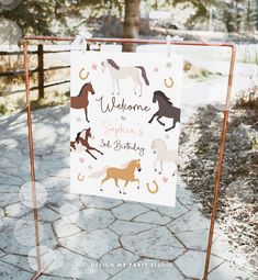 a welcome sign with horses and stars on it