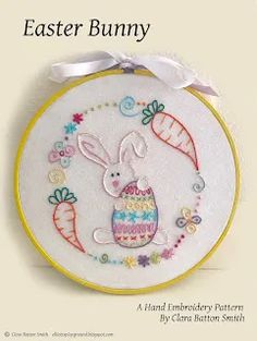 an easter bunny cross stitch pattern on a white background with a ribbon around it's edge