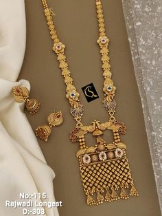 Description :- South Indian Jewellery Set /Temple Jewelry Set /Choker Necklace / Choker Set/ Bollywood Jewelry/ Indian Jewelry/ Gifts Perfect for Indian weddings. All the raw material used in this product is of high quality and is handcrafted with love. Premium Quality and High craftsmanship 100% Satisfaction Guarantee: Long Lasting Plating, High-Quality Stones. Gifting: This pair of charming necklace and earrings come in a beautiful gift box, making it an ideal gift for birthday, wedding annive Temple Jewellery Set, Indian Jewellery Set, Unique Gold Jewelry Designs, Mangalsutra Design, Black Beads Mangalsutra, Black Beads Mangalsutra Design, Temple Jewelry, Mangalsutra Designs, Indian Jewelry Sets