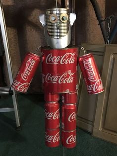 a robot made out of coca cola cans