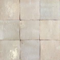 several white tiles arranged in rows on the floor