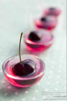 three small cherries sitting on top of a table