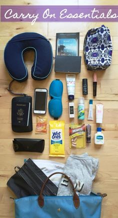 the contents of a carry - on bag laid out on a wooden floor with text overlay that reads carry - on essentials