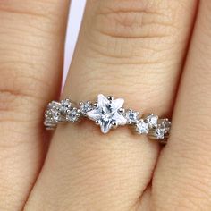 ✩ Solid 925 sterling silver. Good for sensitive skin. ✩ Rhodium plating gives the ring extra shine and durability ✩ Finest diamond simulants ✩ Center stone is a star CZ ✩ Main stone carat weight: 0.75 ✩ Shank width 2 mm ✩ Approx. weight: 2.2 g ✩ Ship beautifully packaged We only choose the finest diamond simulants (CZ 5A) on the market, with a breathtaking level of brightness like real diamonds. Our jewelry can be found in stores and boutiques in Illinois, Indiana and Wisconsin. We always believ Silver Star-shaped Diamond Ring Gift, Dainty Silver Sparkling Rings, Sterling Silver Star-shaped Diamond Ring, Celestial Silver Crystal Ring For Promise, Star-shaped Cubic Zirconia Wedding Rings, Diamond White Star Shaped Ring Gift, Celestial Silver Crystal Promise Ring, Diamond White Star-shaped Anniversary Rings, Elegant Star Shaped Crystal Promise Ring