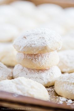 powdered sugar cookies stacked on top of each other